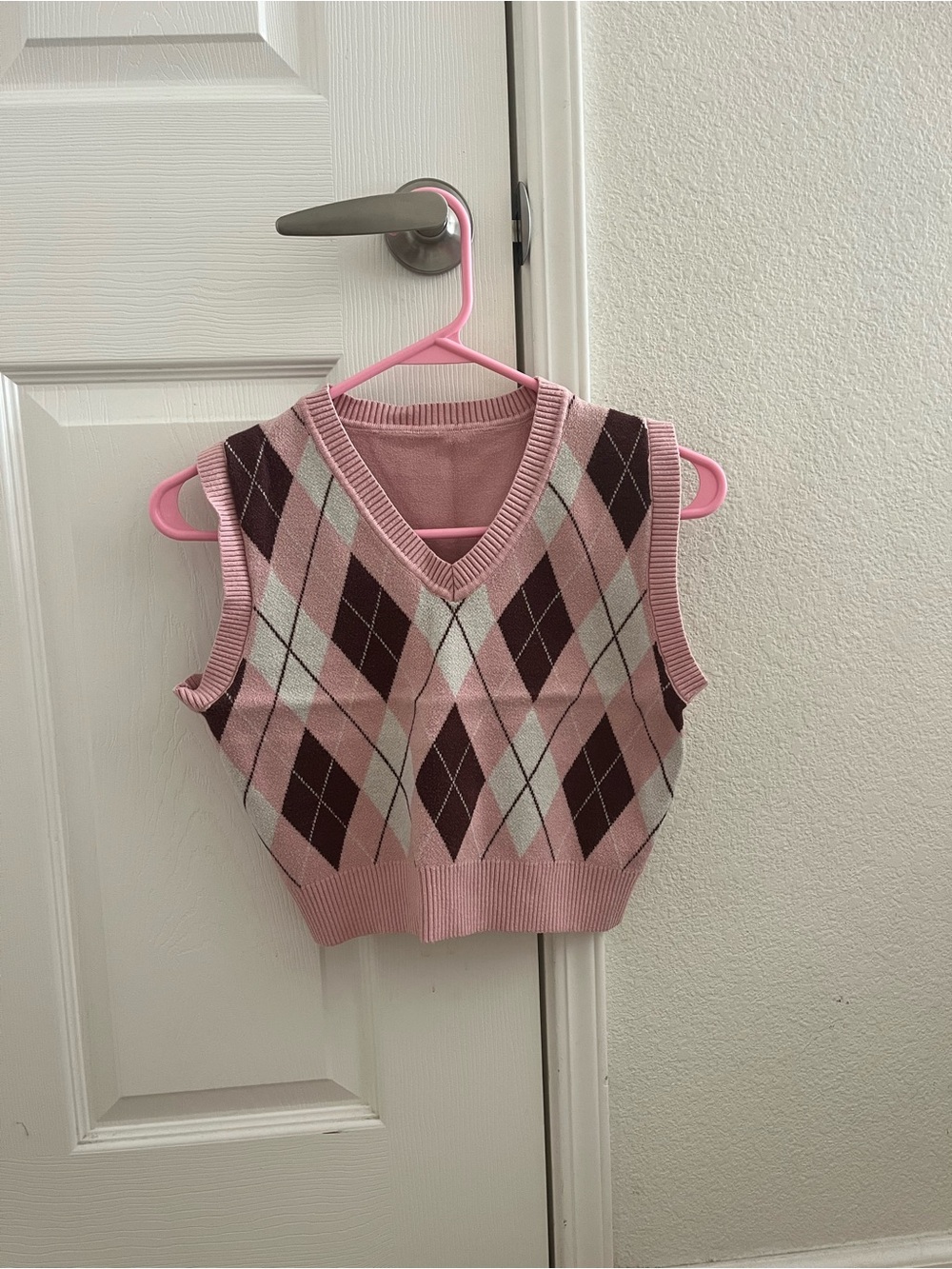 pink sweater vest